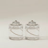 Set of two Rig-Tig Hygge Hurricane vegetable candle refills with natural vegetable-based wax in clear containers.