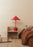 OYOY Kasa table lamp in cherry red with a rounded shade and compact base