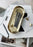 Oval Skultuna tray for accessories, featuring a sleek metallic design with a polished finish, perfect for organizing small items.
