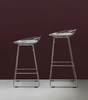 Pastoe KM06 Bar Stool Low, modern seating with wooden legs and upholstered seat, displayed in a contemporary interior setting