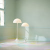 Louis Poulsen Panthella Floor lamp with white opal glass shade, modern lighting fixture on a sleek stand.