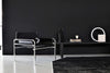 Black leather SZ14 armchair by Pastoe, stylish seating with sleek design and comfortable cushioning.