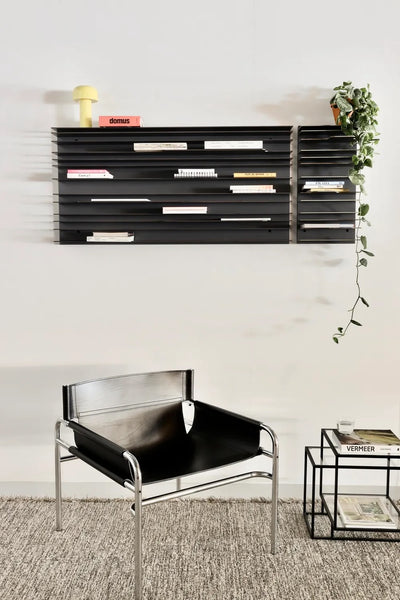 Pastoe SZ14 armchair with black MDF frame, showcasing sleek, modern seating design with cushioned upholstery.