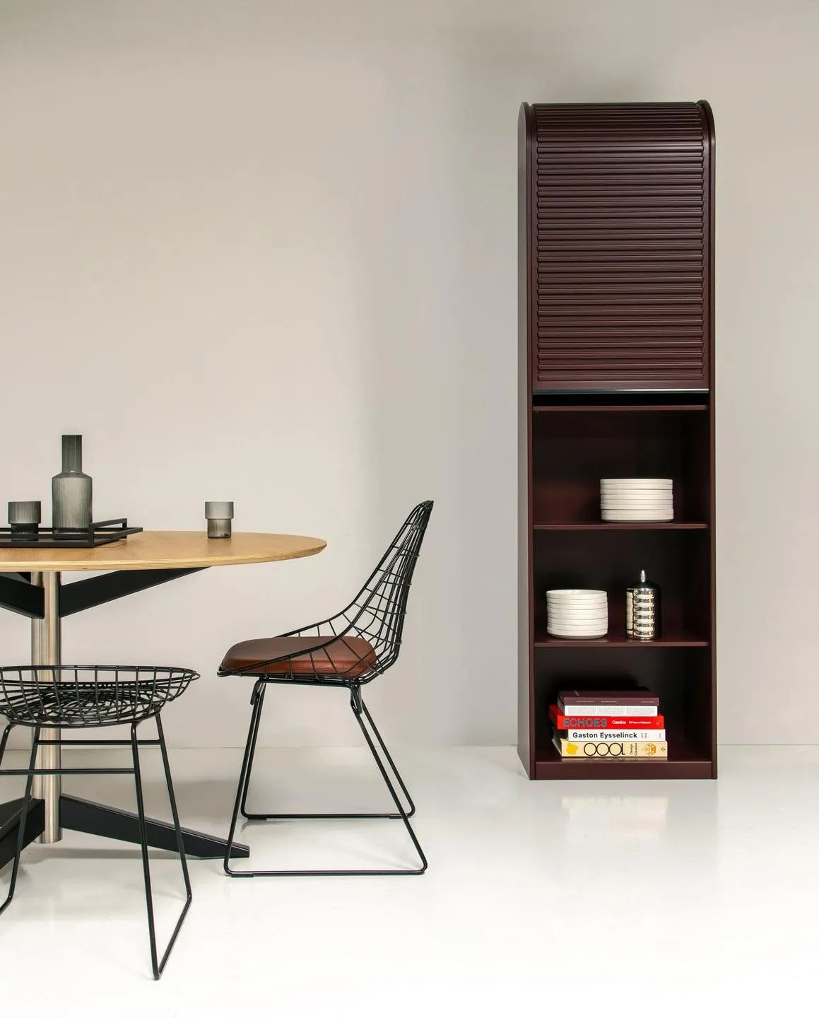 Wire dining chair by Pastoe featuring a sleek, minimalist design with a metal frame and a comfortable seat.