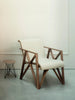 Pastoe armchair for Metz&Co, stylish seating with a modern design, featuring a comfortable upholstered seat and wooden legs.