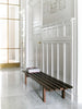 Pastoe BZ Bench seating with wooden legs and upholstered cushion, modern minimalist design for versatile use.