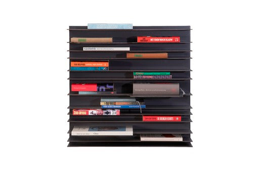 Antracite Paperback Wallsystem storage unit by Pastoe with 60x60 cm compartments and front-facing books.
