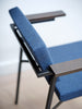 Close-up of the Pastoe SE69 dining chair showing its sleek wooden frame and upholstered seat for comfortable seating.
