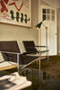 Pastoe SZ02 armchair with leather backrest, stylish seating piece featuring modern design and comfortable cushioning.