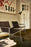 Pastoe SZ02 armchair with leather backrest, stylish seating piece featuring modern design and comfortable cushioning.