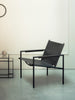 Pastoe SZ02 armchair with leather upholstery and wooden backrest, showcasing modern seating design and craftsmanship.
