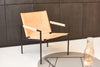 Brown leather SZ02 armchair by Pastoe, showcasing sleek modern seating with smooth upholstery and stylish design.