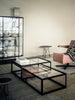 Pastoe Tangled coffee table with a unique intertwined design, showcasing modern style and craftsmanship in a living room setting.