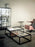 Pastoe Tangled coffee table with a unique intertwined design, showcasing modern style and craftsmanship in a living room setting.