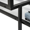 Close-up of the black Tangled Cabinet by Pastoe, showcasing its intricate storage design and textured surface with books nearby.