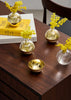 Close-up of the elegant Pomme accessory by Skultuna, showcasing its sleek design and polished metallic finish.