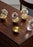 Skultuna Pomme accessories featuring a sleek, modern design with smooth curves and a polished metal finish.