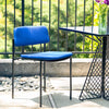 The Rachel Chair by Bend Goods, a modern black metal seating with a curved backrest and sleek design.