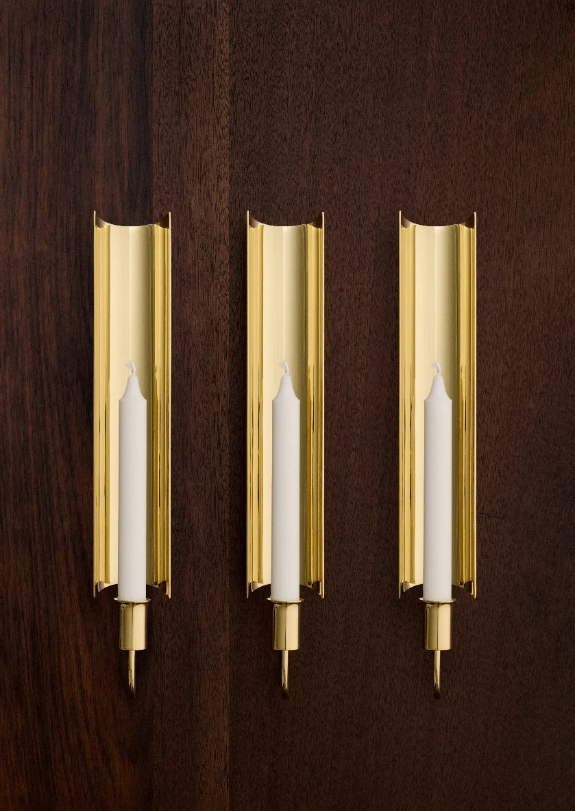 Reflex Sconce by Skultuna, modern wall accessory with sleek design, showcasing smooth metal finish and minimalist aesthetic.