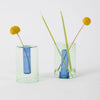 Small reversible glass vase in green and blue by Block Design, showcasing a sleek, modern accessory with a transparent, colorful design.