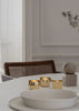 Skultuna Kin accessories displayed with sleek design and modern details, showcasing elegant craftsmanship and stylish metal finishes.