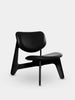 Black Slab Lounge Chair by Tom Dixon featuring brushed oak frame and black leather upholstery, modern seating design.