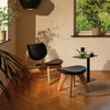 Tom Dixon Slab Lounge Chair in natural brushed oak with black leather upholstery, showcasing modern seating design.