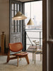 Slab lounge chair by Tom Dixon with natural brushed oak frame and cognac leather seat for modern seating.
