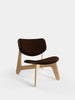 Tom Dixon Slab lounge chair with natural wood frame and brown Choko leather upholstery, modern seating with sleek design