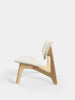 Natural wood Slab Lounge Chair by Tom Dixon with Kvadrat Elle Boucle upholstery, modern seating with sleek design and smooth textures.