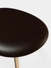 Brown leather Slab Ottoman by Tom Dixon, modern seating piece with a sleek, minimalist design and textured surface.
