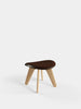 Brown leather Slab Ottoman by Tom Dixon, versatile seating piece with a modern, sleek design and textured surface.