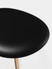 Tom Dixon Slab Ottoman with natural brushed oak frame and black leather seating, modern and stylish seating piece.