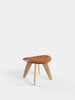 Tom Dixon Slab Ottoman with natural brushed oak base and cognac leather top, stylish seating piece with modern design.