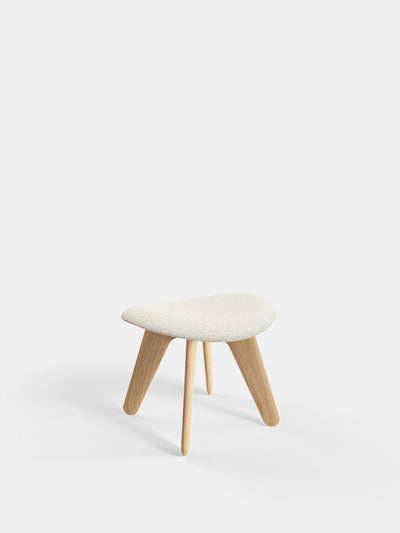 Natural Kvadrat Elle Bouclé Slab Ottoman by Tom Dixon, a modern beige seating piece with a smooth, rounded design.