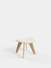 Natural Kvadrat Elle Bouclé Slab Ottoman by Tom Dixon, a modern beige seating piece with a smooth, rounded design.