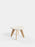 Natural Kvadrat Elle Bouclé Slab Ottoman by Tom Dixon, a modern beige seating piece with a smooth, rounded design.