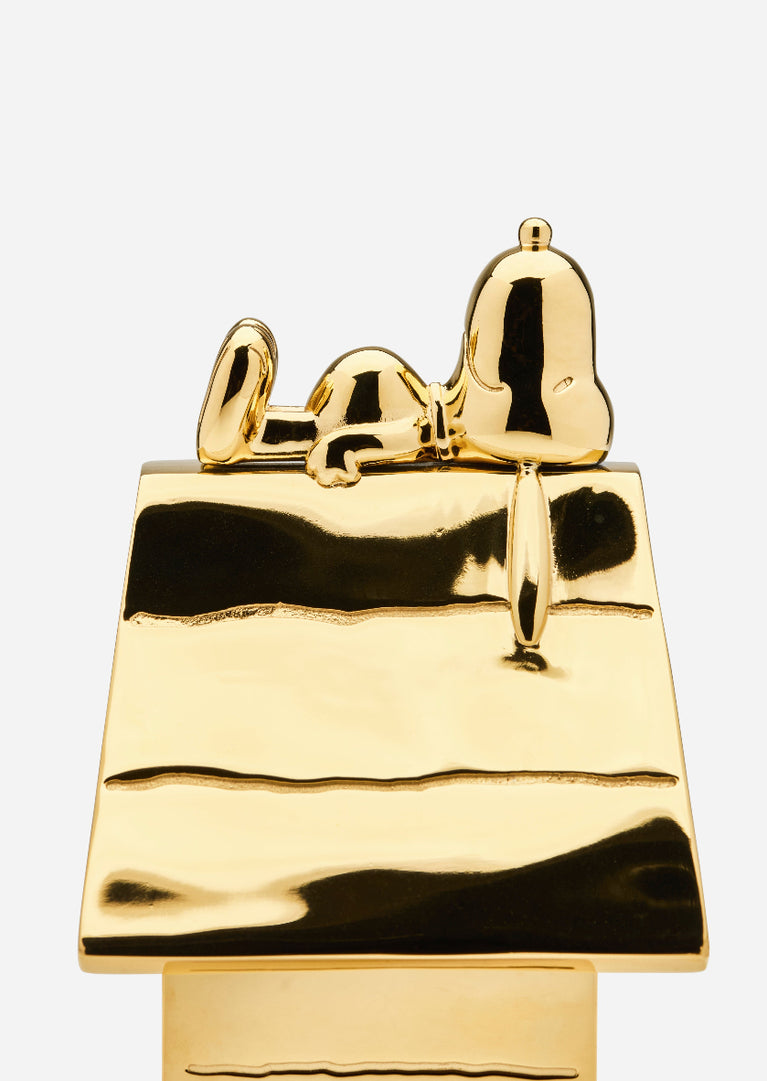 Snoopy on the Roof accessory by Skultuna featuring a detailed Snoopy figure perched on a roof, crafted in high-quality materials.