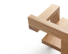 Pastoe Stelman Chair with left armrest, natural wood finish, showcasing Gerrit Rietveld-inspired seating design.