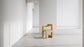 Pastoe Stelman Chair with left armrest, modern seating with sleek design and wooden legs, showcasing contemporary home furniture.