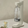 Stelton Brus Carbonator accessories in soft sand color, designed for carbonating beverages with sleek modern style.