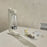 Stelton Brus Carbonator accessory in soft sand color, designed for sparkling water bottles, with a sleek modern look.