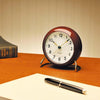 Station table clock by Arne Jacobsen, minimalist accessory with a sleek design, featuring a round face and modern style.