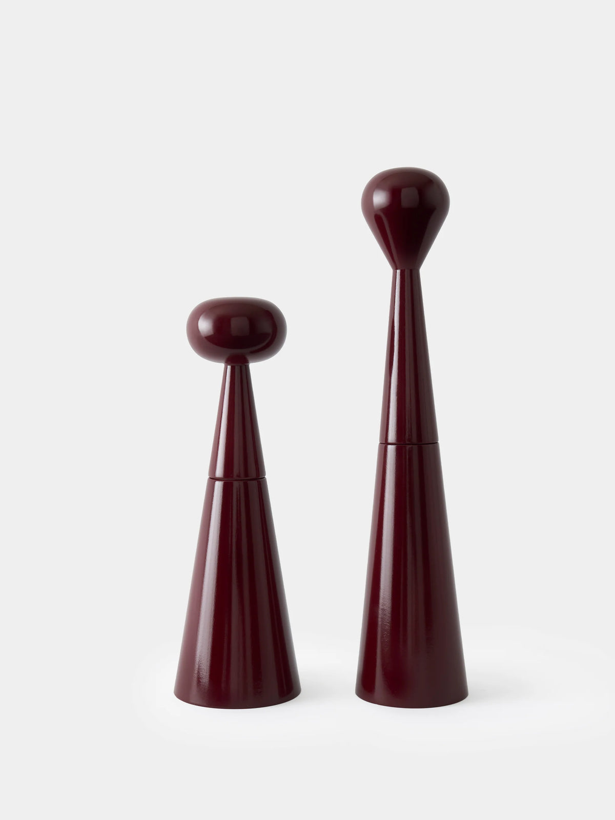 Tom Dixon Brew Mill accessory with tall, matte burgundy grinder for coffee or spices.