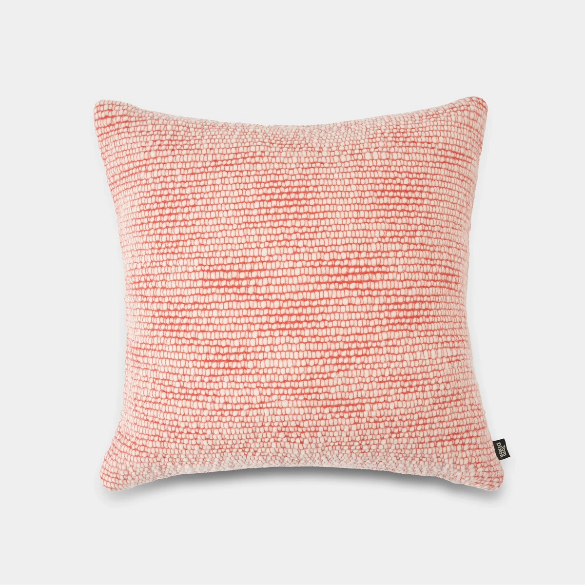 Tom Dixon Thread Cushion in warm orange with textured fabric, decorative accessory for sofa or bed.