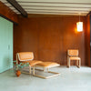 Modern Tube Lounge Chair by Bend Goods featuring sleek metal frame and cushioned seat for stylish, comfortable seating.