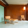 Modern Bend Goods Tube Chair with sleek metal frame and plush upholstered seat, ideal for contemporary seating spaces.