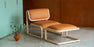 Bend Goods Tube Ottoman in a sleek, modern design, used as versatile seating or a footrest in contemporary living spaces.