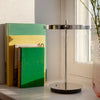 UMAGE Asteria Move portable lamp in polished steel finish, shown in a contemporary interior setup