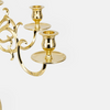 Elegant Skultuna candelabra accessory with polished metal finish, featuring multiple arms for candles and decorative design.
